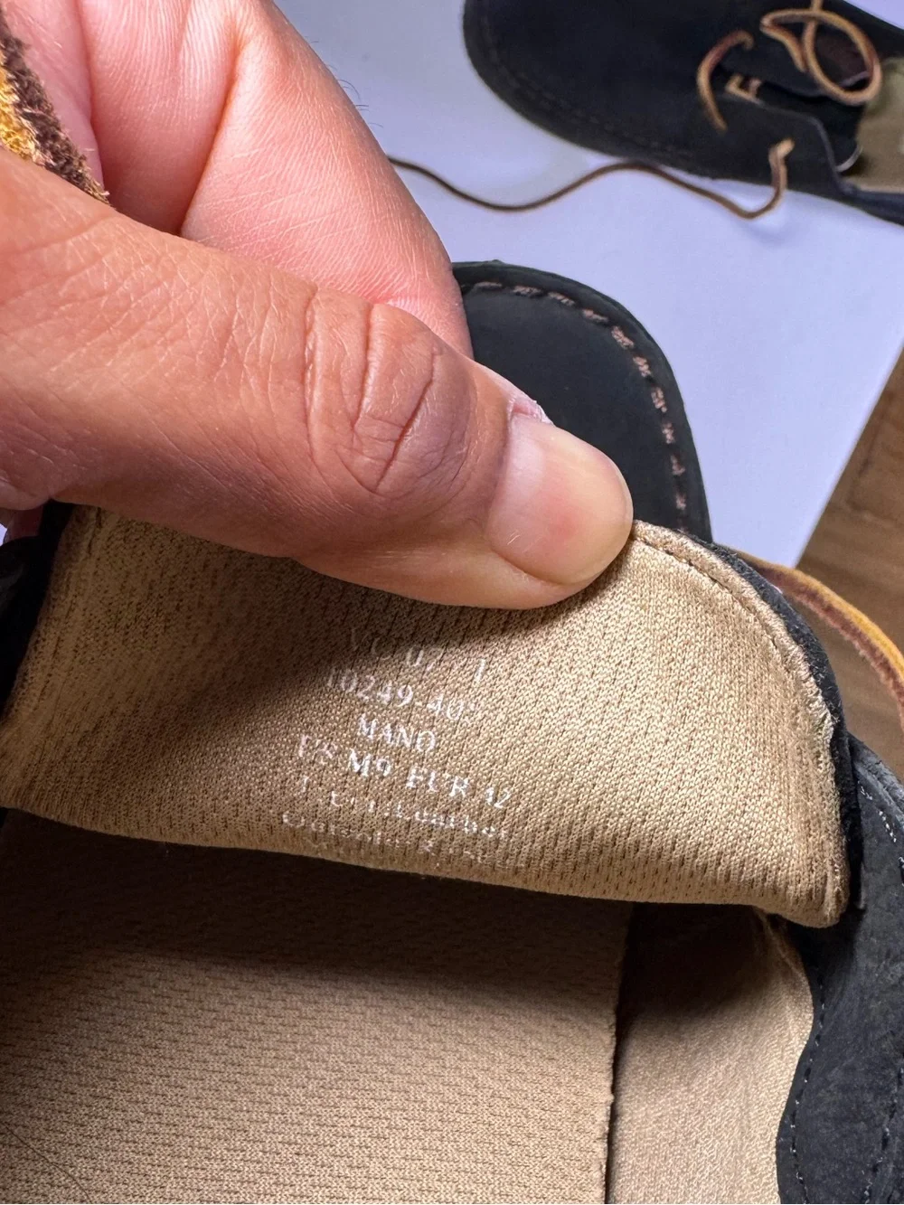OluKai Black and Brown Leather Boat Moccasins with Tan Laces